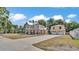 Expansive property showcasing a two-story home and garage, perfect for comfortable living and storage at 410 S Broadway Ave, Bartow, FL 33830