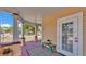 Charming front porch detail with ample space to relax and enjoy the outdoors with a side door access at 410 S Broadway Ave, Bartow, FL 33830