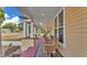 Inviting front porch featuring wooden benches and a charming outdoor space for relaxing at 410 S Broadway Ave, Bartow, FL 33830