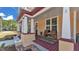 Inviting front porch featuring comfortable seating and a charming space to relax outdoors at 410 S Broadway Ave, Bartow, FL 33830