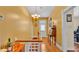 Hallway with hardwood floors, a vintage desk, and a white front door at 410 S Broadway Ave, Bartow, FL 33830