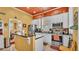 Well-lit kitchen featuring stainless steel appliances, granite counters, and stylish lighting at 410 S Broadway Ave, Bartow, FL 33830