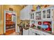 Charming kitchen area with custom cabinets, stainless appliances, and an adjacent dining room at 410 S Broadway Ave, Bartow, FL 33830