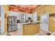 This beautifully designed kitchen features modern appliances, granite counters, and a unique ceiling at 410 S Broadway Ave, Bartow, FL 33830