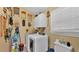 Functional laundry room with modern appliances and vintage decor at 410 S Broadway Ave, Bartow, FL 33830