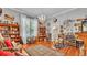 Charming living room with hardwood floors, ample natural light, and vintage decor at 410 S Broadway Ave, Bartow, FL 33830