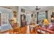 Cozy living room featuring hardwood floors, comfortable seating, and lots of unique decor at 410 S Broadway Ave, Bartow, FL 33830