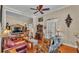 Relaxing living room features hardwood floors, cozy seating, and natural light at 410 S Broadway Ave, Bartow, FL 33830