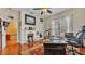 Bright home office with fireplace, hardwood floors, and a large desk at 410 S Broadway Ave, Bartow, FL 33830