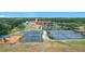 Aerial view of the community amenities with playground, tennis courts, pool, and community center at 4219 Windchime Ln, Lakeland, FL 33811