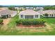 Aerial view of a lovely home with lush backyard, set amidst a tranquil neighborhood and a glimpse of the water at 4219 Windchime Ln, Lakeland, FL 33811