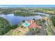 A scenic view of the lake surrounding the clubhouse and parking area in the community at 4219 Windchime Ln, Lakeland, FL 33811