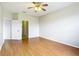 An empty bedroom features a ceiling fan and wood-look flooring at 4219 Windchime Ln, Lakeland, FL 33811
