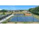 Community basketball, tennis, and pickleball courts with nearby playground at 4219 Windchime Ln, Lakeland, FL 33811