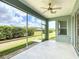 A screened patio provides outdoor seating with a view of the backyard at 4219 Windchime Ln, Lakeland, FL 33811