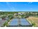 Two well-maintained community tennis courts with lighting and scenic views at 4219 Windchime Ln, Lakeland, FL 33811