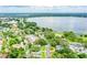 Scenic aerial view of the home surrounded by lush greenery and a beautiful lake at 422 E Belmar St, Lakeland, FL 33803
