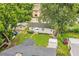 Aerial view of a home with a fenced yard and mature trees, offering privacy at 422 E Belmar St, Lakeland, FL 33803