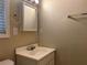 A clean bathroom featuring a vanity, mirror, and towel rack, accented by natural light at 422 E Belmar St, Lakeland, FL 33803