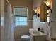 Bright bathroom with a shower and vanity at 422 E Belmar St, Lakeland, FL 33803