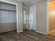 Bedroom features stylish flooring, closet access, and convenient entryways to the home's layout at 422 E Belmar St, Lakeland, FL 33803