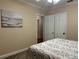 Bedroom featuring art, a bed, and a closet at 422 E Belmar St, Lakeland, FL 33803