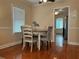 Cozy dining area with hardwood floors, neutral paint and modern decor at 422 E Belmar St, Lakeland, FL 33803