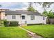 Charming single-story home with a well-manicured lawn and welcoming entryway at 422 E Belmar St, Lakeland, FL 33803