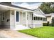 Charming one-story home with manicured lawn, awning, and covered entry at 422 E Belmar St, Lakeland, FL 33803