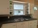 Functional kitchen featuring a double sink and ample cabinet space at 422 E Belmar St, Lakeland, FL 33803