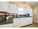 Well-lit kitchen with white cabinetry, providing ample storage space at 422 E Belmar St, Lakeland, FL 33803