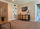 Bright living area with a built-in bookshelf, stylish accent furniture, and natural light at 422 E Belmar St, Lakeland, FL 33803