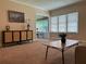 Open living area with stylish furniture, a view into a sunroom, and bright natural light at 422 E Belmar St, Lakeland, FL 33803