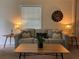 Inviting living room showcasing a comfortable sofa, side tables, and a large clock at 422 E Belmar St, Lakeland, FL 33803