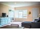 Cozy living room featuring neutral walls, comfortable seating, and a view of the outdoors at 422 E Belmar St, Lakeland, FL 33803