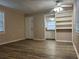 An open living room featuring hardwood floors and open view of the kitchen and its appliances at 422 E Belmar St, Lakeland, FL 33803