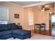 Cozy living room featuring hardwood floors, comfortable seating, and a ceiling fan at 422 E Belmar St, Lakeland, FL 33803