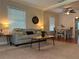 Cozy living room featuring a comfortable sofa, stylish decor, and hardwood floors at 422 E Belmar St, Lakeland, FL 33803