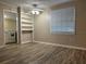 Inviting living area with hardwood floors, built-in shelving, and a view into the kitchen at 422 E Belmar St, Lakeland, FL 33803