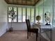 Serene sunroom with ample natural light, a quaint desk, and cozy decor at 422 E Belmar St, Lakeland, FL 33803
