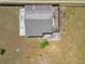 Aerial view showing a well maintained shingle roof and a large yard at 5201 Dorman Rd, Lakeland, FL 33813