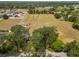 Aerial view showing large land plot surrounded by homes and trees in a quiet neighborhood at 5201 Dorman Rd, Lakeland, FL 33813