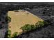 Aerial view highlighting the lot's expansive space, showcasing development potential with an adjacent neighborhood backdrop at 5201 Dorman Rd, Lakeland, FL 33813