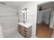 Tiled bathroom featuring a vanity, bathtub, and updated fixtures for a clean and modern look at 5201 Dorman Rd, Lakeland, FL 33813