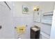 Well-lit bathroom with new shower, vanity with granite countertop, and tile walls at 5201 Dorman Rd, Lakeland, FL 33813