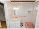 Well-lit bathroom with vanity and tiled walls with updated fixtures at 5201 Dorman Rd, Lakeland, FL 33813