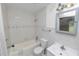 Bright bathroom featuring tiled walls, vanity, sink, mirror, toilet, bathtub, and shower at 5201 Dorman Rd, Lakeland, FL 33813