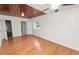 A well-lit bedroom features wood ceiling and floors and two windows at 5201 Dorman Rd, Lakeland, FL 33813
