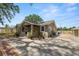 Charming single-story home with a covered front porch and beautifully landscaped front yard at 5201 Dorman Rd, Lakeland, FL 33813