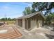 A detached two-car garage with white doors and access to the backyard deck at 5201 Dorman Rd, Lakeland, FL 33813